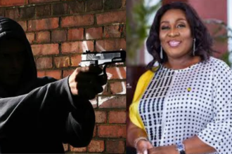 stock photo of armed robber and Sedina Tamakloe