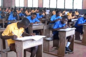 Students writing examinations